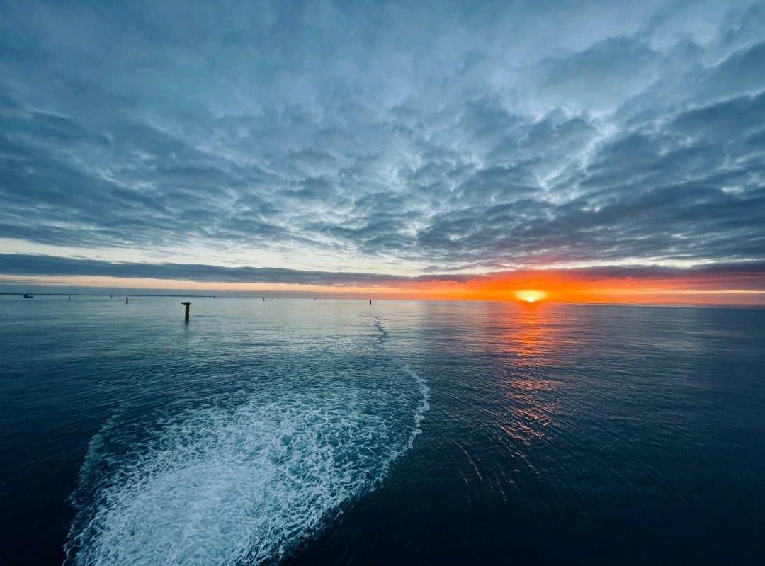 sunset on OSS Offshore Wind Turbine
